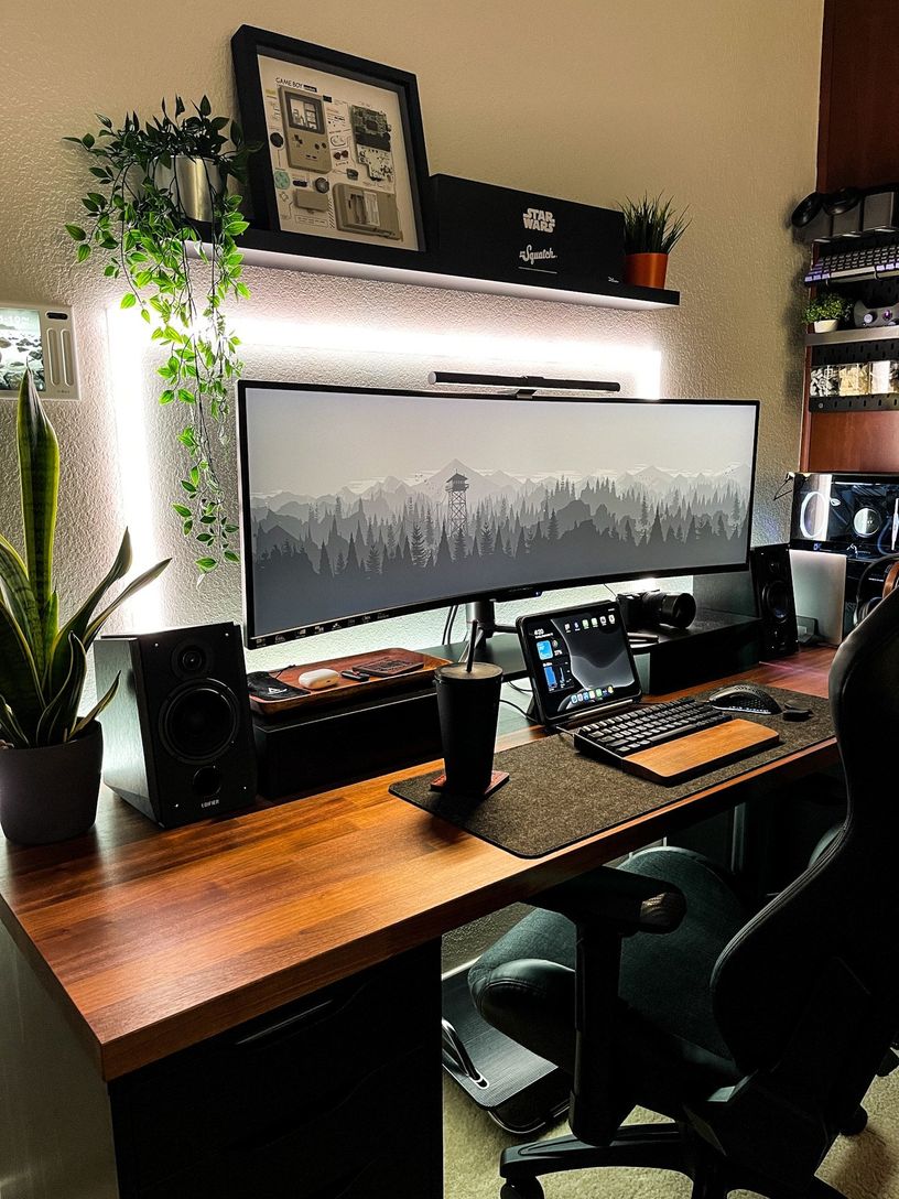 Brown and black wooden desk setup optimized for productivity