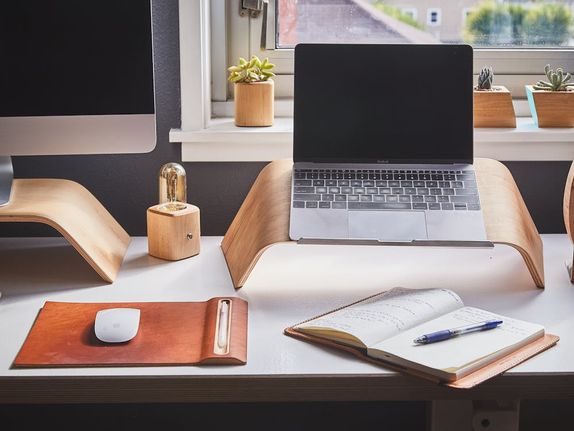 Organized and clean modern desk with a mac computer and macbook laptop